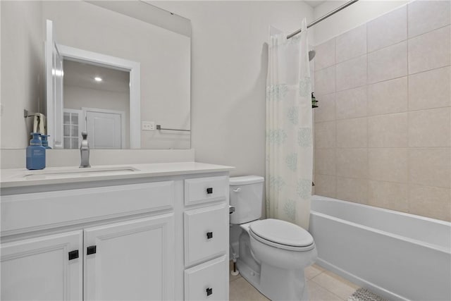 full bathroom with shower / tub combo with curtain, vanity, tile patterned flooring, and toilet