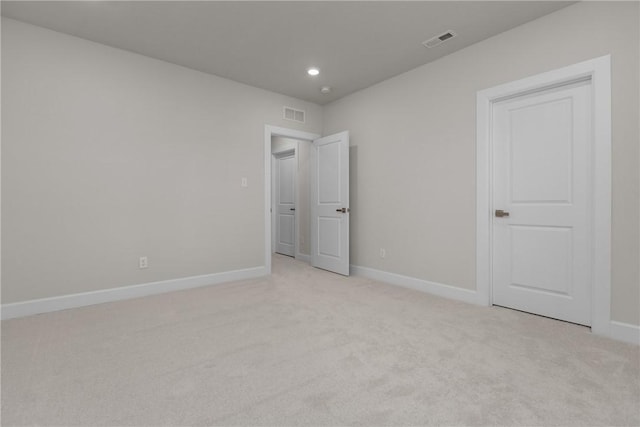 unfurnished bedroom featuring light colored carpet