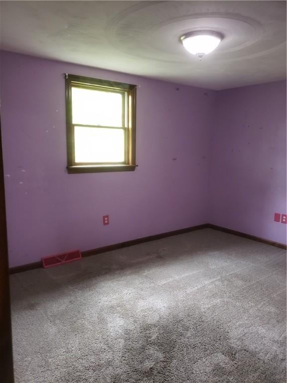 view of carpeted spare room