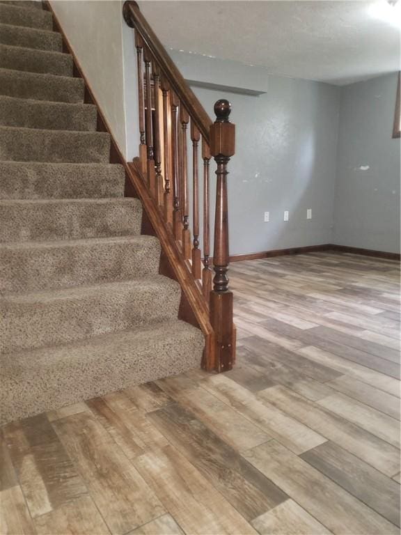 staircase featuring hardwood / wood-style flooring