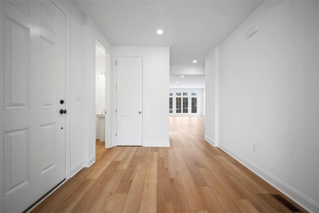 corridor featuring light wood-type flooring