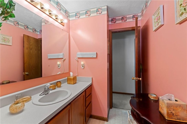 bathroom featuring vanity and a textured ceiling