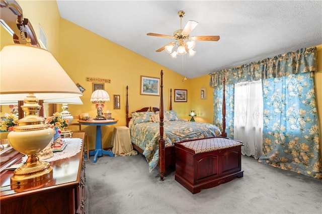 bedroom with vaulted ceiling, carpet flooring, and ceiling fan