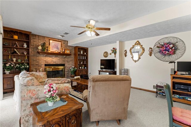 105 Lawrence Dr, Brighton Twp, PA 15009 - living area featuring a textured ceiling, carpet floors, ceiling fan, a brick fireplace, and baseboards