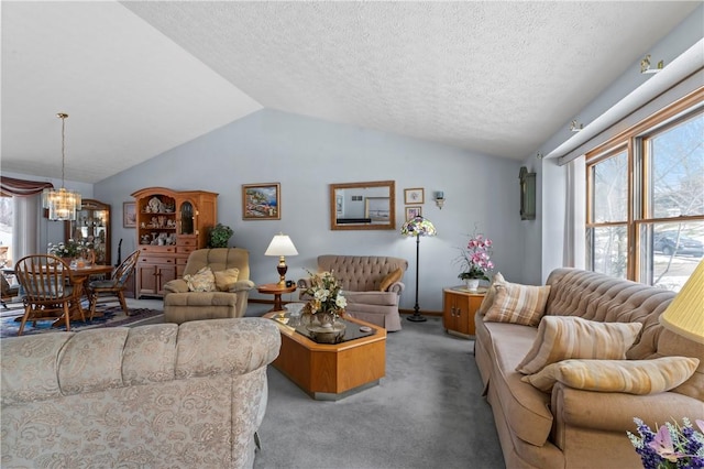 living room with light carpet, a textured ceiling, lofted ceiling, and a chandelier