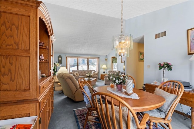 dining space with vaulted ceiling, dark carpet, a textured ceiling, and a notable chandelier