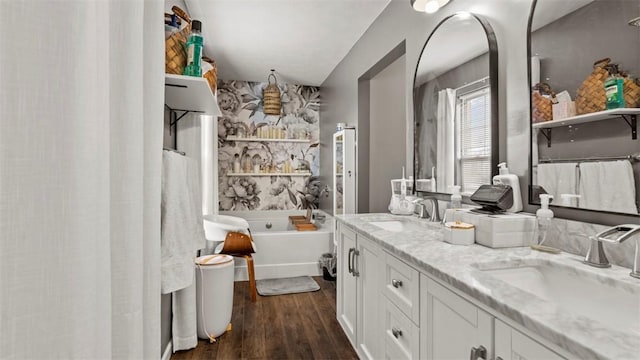 bathroom with vanity, hardwood / wood-style floors, and bathing tub / shower combination