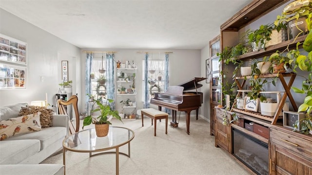 sitting room featuring light colored carpet