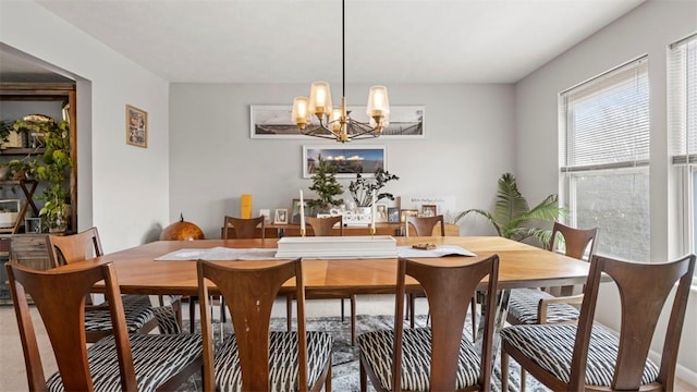 dining area featuring a chandelier