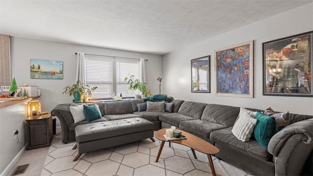 carpeted living room featuring a textured ceiling