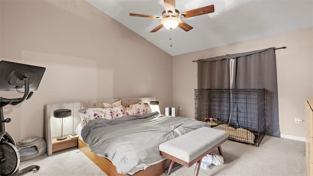 carpeted bedroom featuring ceiling fan and vaulted ceiling