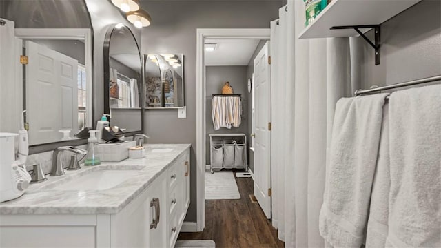 bathroom with vanity and hardwood / wood-style flooring