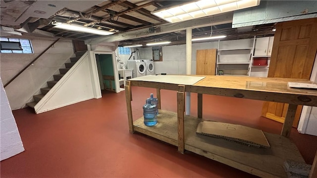 basement featuring washer and dryer and electric panel