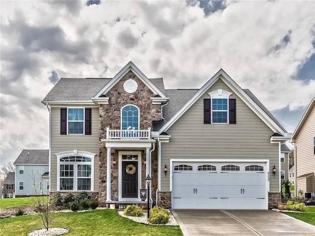 view of front of house with a garage and a front yard