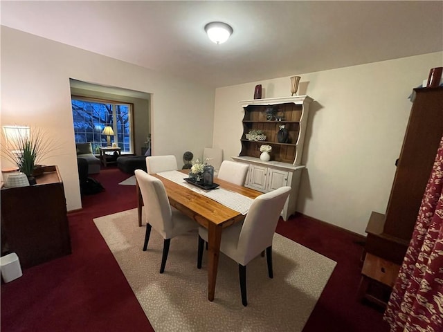 view of carpeted dining area