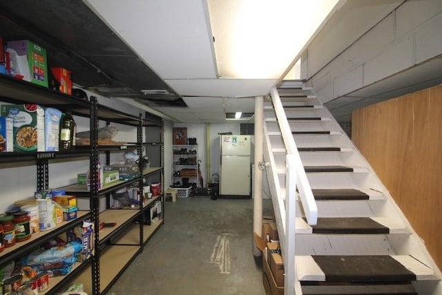 basement featuring refrigerator