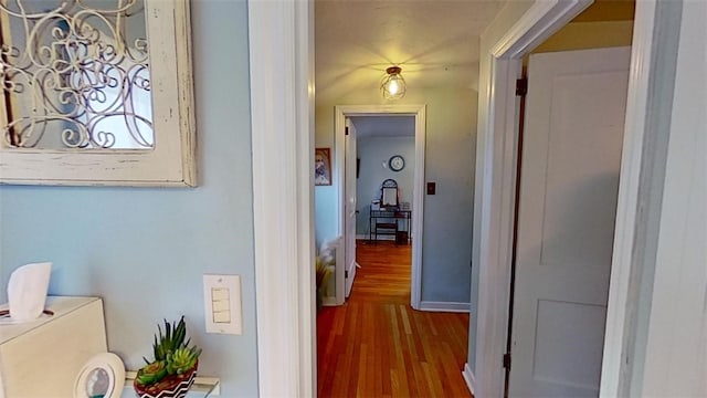 corridor with wood-type flooring