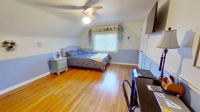 bedroom featuring vaulted ceiling, light hardwood / wood-style floors, and ceiling fan