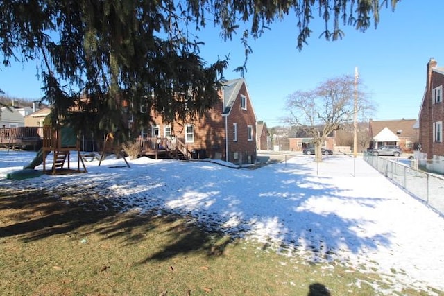 view of yard layered in snow