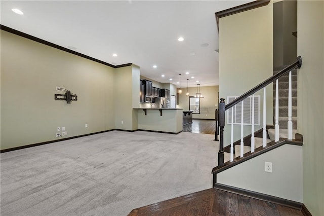 unfurnished living room featuring ornamental molding