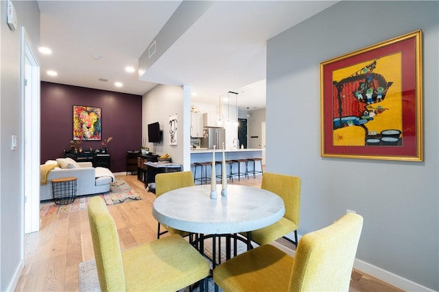 dining room featuring wood-type flooring