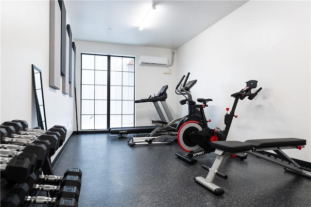 exercise room with a wall mounted air conditioner