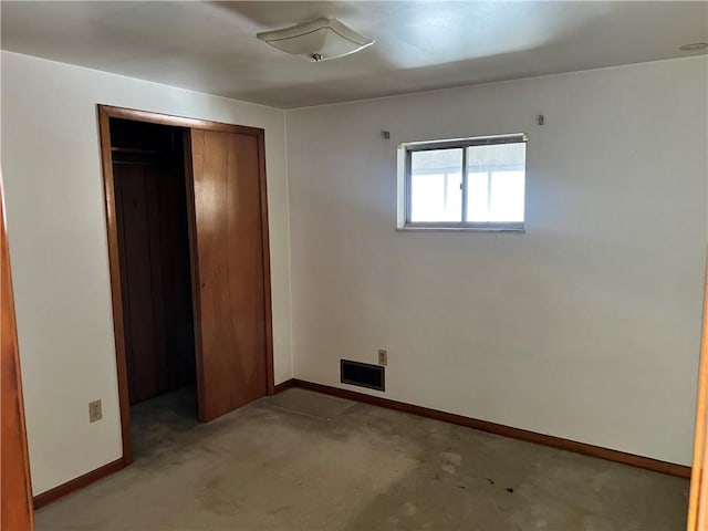 unfurnished bedroom with a closet