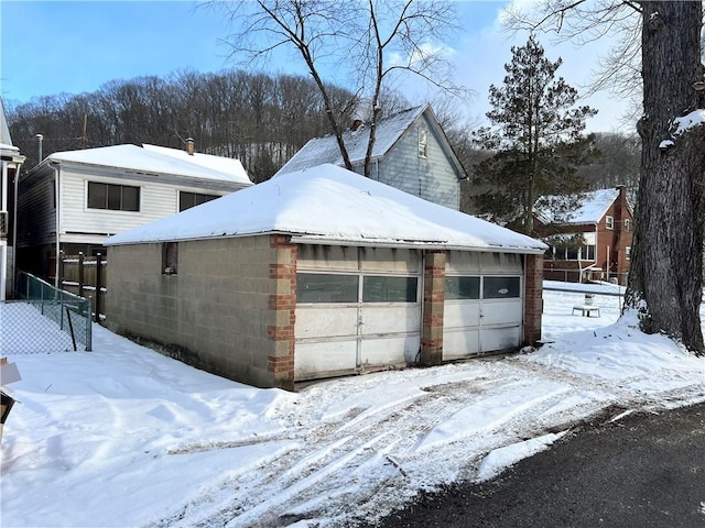 view of snow covered garage