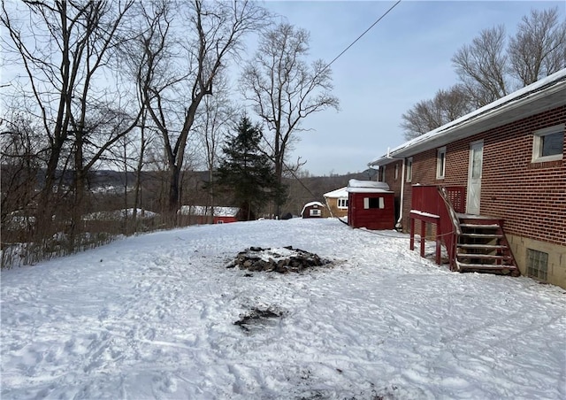 view of yard layered in snow