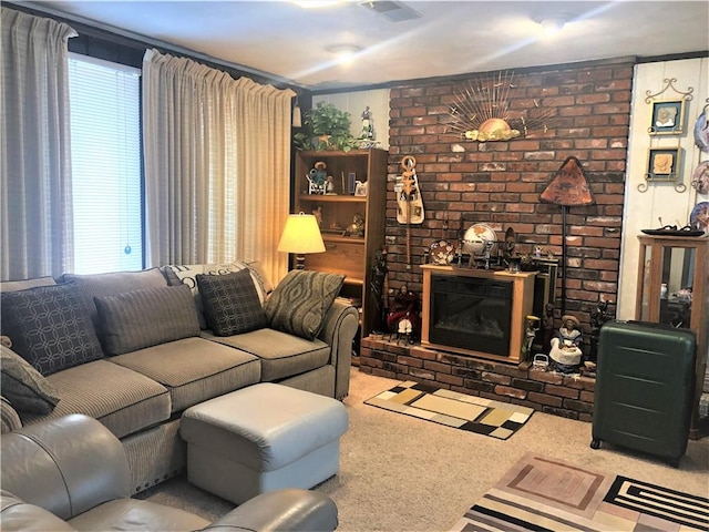 carpeted living room featuring a brick fireplace