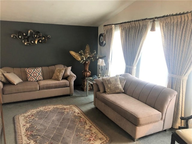 living room with lofted ceiling and carpet flooring