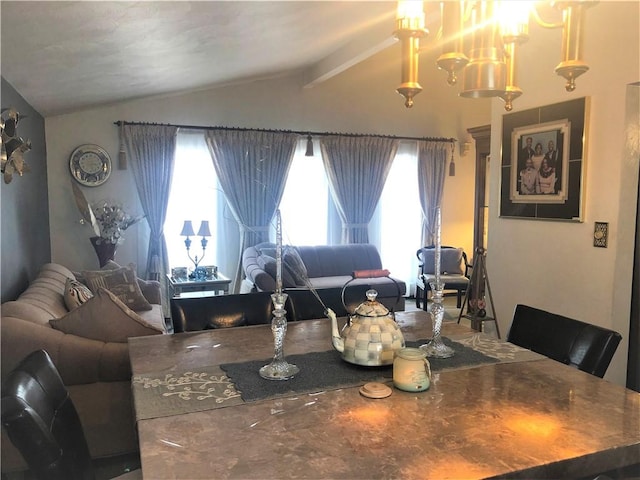 dining area featuring vaulted ceiling and a wealth of natural light