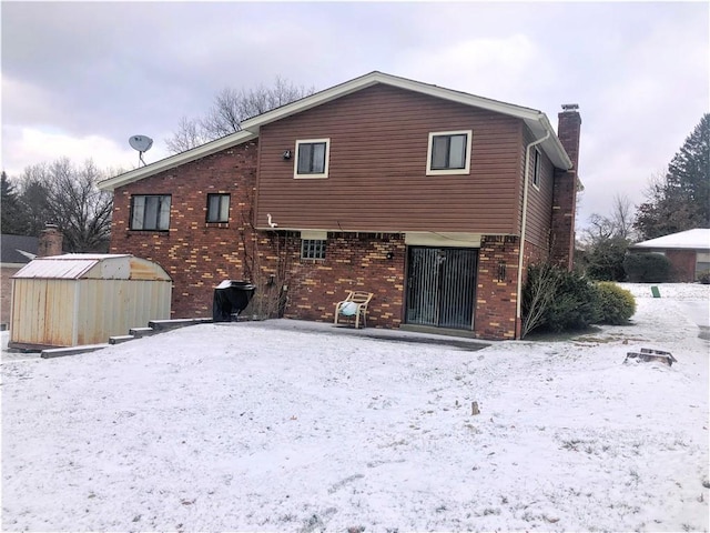 view of snow covered house