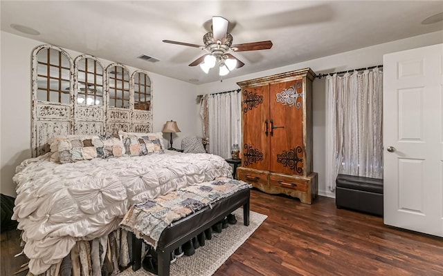 bedroom featuring dark wood-type flooring and ceiling fan