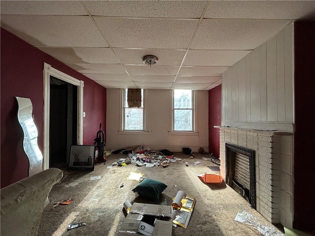 miscellaneous room featuring a drop ceiling and a fireplace