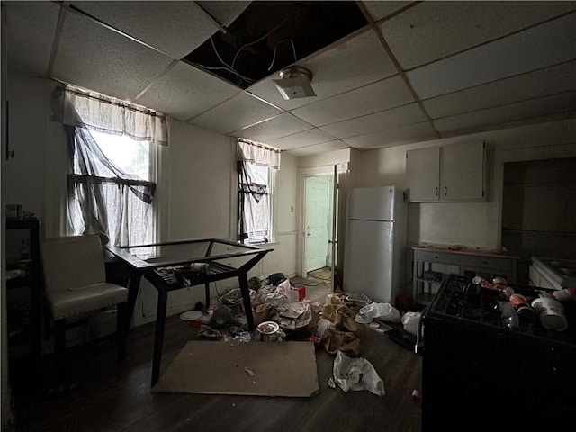 miscellaneous room with hardwood / wood-style floors and a paneled ceiling