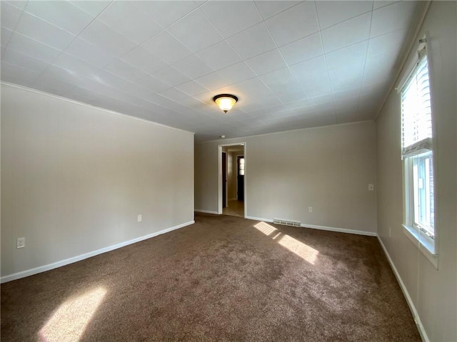 carpeted empty room featuring a healthy amount of sunlight