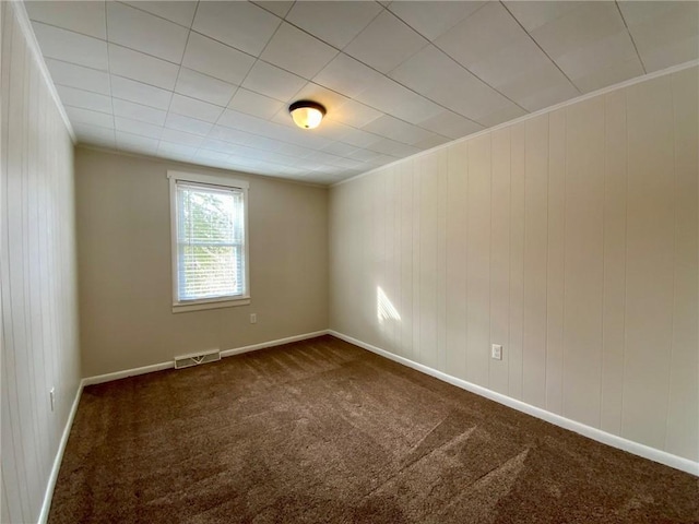 carpeted empty room with crown molding