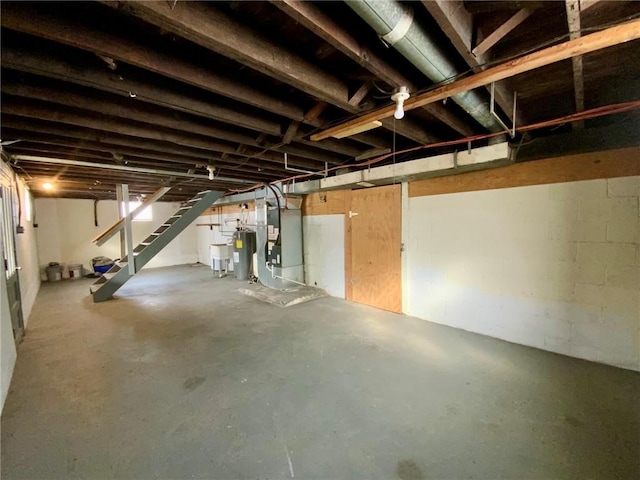 basement with water heater and heating unit