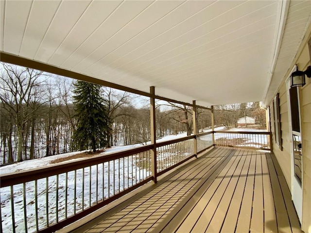 view of snow covered deck