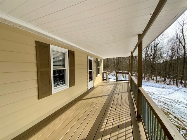 view of snow covered deck