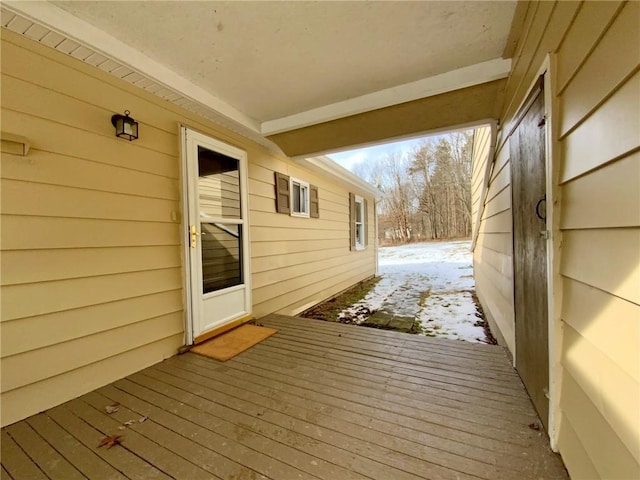 view of snow covered deck