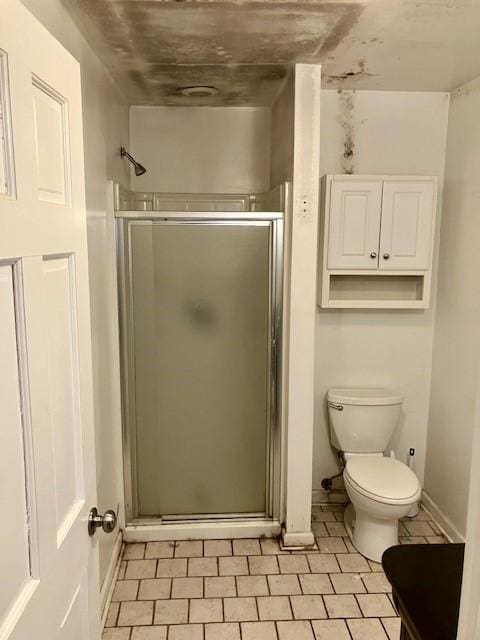 bathroom with toilet and walk in shower