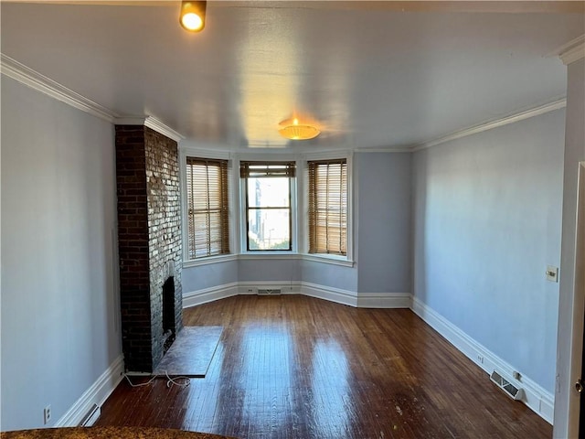 unfurnished living room with ornamental molding, dark hardwood / wood-style floors, and a brick fireplace