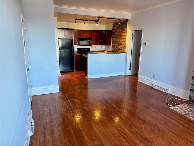 kitchen featuring sink, dark hardwood / wood-style floors, track lighting, ornamental molding, and black appliances