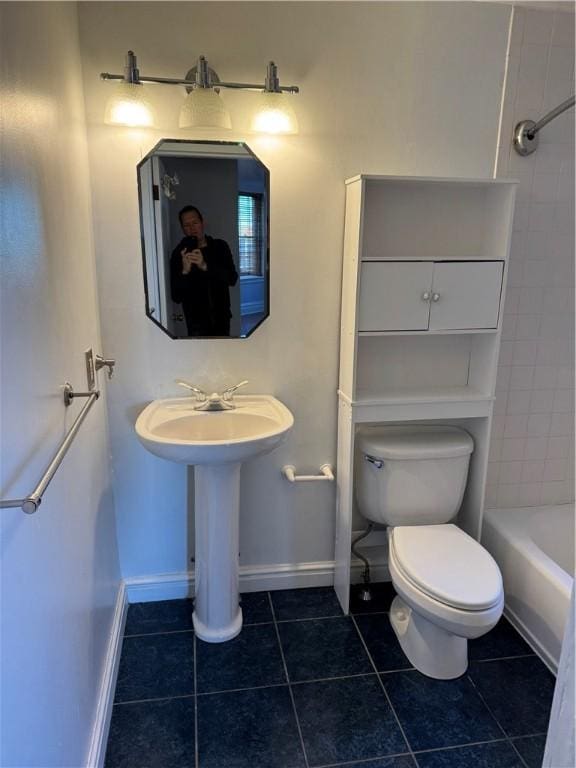 bathroom featuring tile patterned floors and toilet