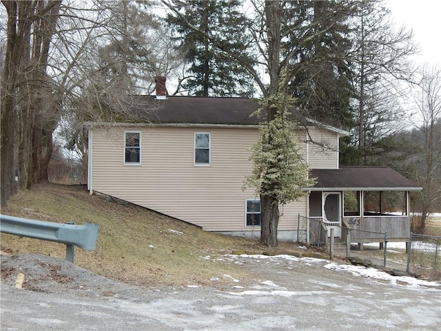 view of home's exterior with covered porch