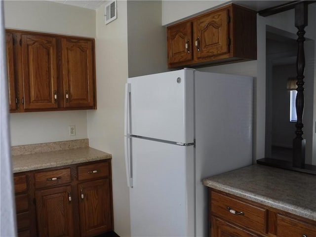 kitchen featuring white fridge