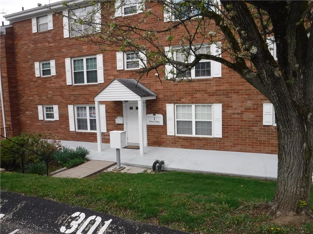 1 Hiland Valley Dr Unit 103, Ross Twp, PA 15229 - view of front of home featuring brick siding