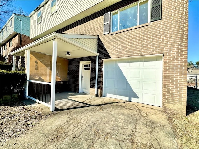 view of exterior entry with a garage